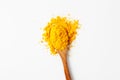 Turmeric spices in a wooden spoon on a white background Royalty Free Stock Photo