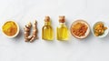 Turmeric in various forms including fresh roots, powder, and oil displayed on a white background, emphasizing its Royalty Free Stock Photo
