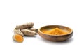 Turmeric, whole root and powder, healthy spice with anti-inflammatory and antioxidant properties, isolated with small shadows on a