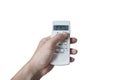 Turn on the air conditioner at 26 degrees Celsius. Hand holding the air conditioner remote control and thumb is pressing a button Royalty Free Stock Photo