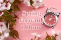 Turn clocks on hour ahead, star of daylight savings time change and reminder to spring forward concept with clock on pink Royalty Free Stock Photo