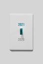 Concept idea of new year turning switch on to year 2021. Royalty Free Stock Photo