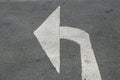 Turn left arrow on asphalt street Royalty Free Stock Photo