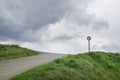 Turn left prohibited sign in surrealistic and desolate landscape Royalty Free Stock Photo