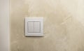 Turn the light on or off. A white light switch on the wall. Royalty Free Stock Photo
