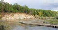 Turn North kempendyay river to the shore of sand eroded by the flow of water in the spruce forest Royalty Free Stock Photo