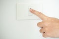 Turn off the light, close up man hand is closing the power switch Royalty Free Stock Photo