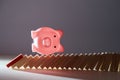 Turn over piggy bank on falling domino blocks, copy space. Financial crisis mockup. Domino effect. Irreversible process