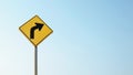 Turn right yellow traffic sign against blue sky Royalty Free Stock Photo