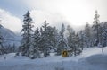 Turn Sign Above Snow Drift on Mountain Road Royalty Free Stock Photo