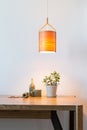 Turn on wooden lamp over the wooden table