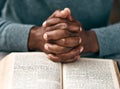 Turn your worries into prayers. an unrecognizable man reading a book.