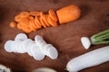 Turned carrots and radishes Placed on a wooden chopping board. Royalty Free Stock Photo