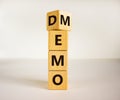 Turned cube and changed the word `demo` to `memo`. Beautiful white background. Business and demo and memo concept. Copy space