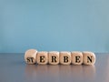 Turned dice and changes the German word \'Sterben\' (die) to \'erben\' (inherit).