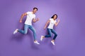 Turned full length body size photo of cute pretty nice couple of two people running jumping for sales in t-shirt white