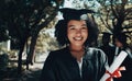 She turned her cants into cans, and her dreams into plans. a student holding her diploma on graduation day. Royalty Free Stock Photo