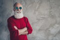 Turned photo of positive festive old stylish man cross hands enjoy x-mas party celebration wear modern pullover isolated