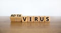 Turned wooden cubes and changed the word \'virus\' to \'rotavirus\'. Beautiful wooden table white