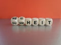 Turned wooden cubes and changes the German word Dummheit to Weisheit