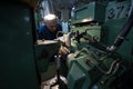 Turner middle-aged man working on a milling machine