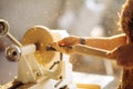 Wood lathe. Carpenter lathing wood Royalty Free Stock Photo