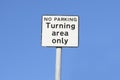 Turning area only no parking sign against blue sky Royalty Free Stock Photo