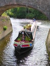 Narrowboat passing under bridge