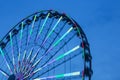 Turning Ferris Wheel At Sunset