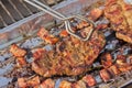 Turning grilled steak and bacon Royalty Free Stock Photo