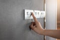 Turning on or off on grey light switch Royalty Free Stock Photo