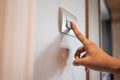 Turning on or off on grey light switch Royalty Free Stock Photo
