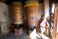 Turning prayer wheels, Jampey Lhakhang Dzong