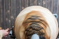 Turning wooden bowls on a lathe. The close up view of spinning the lathe machine