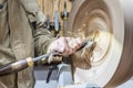 Turning wooden bowls on a lathe. The close up view of spinning the lathe machine Royalty Free Stock Photo