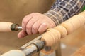 Turning a wooden part on a lathe. Joinery. Carpentry work. Mechanical woodworking