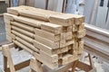 Turning wooden stair balusters. Wood stair balusters stacked in workshop