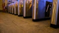 The turnstile of a subway station with people passing through, public transportt. Concept. Modern turnstiles for the