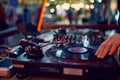 Turntable, hand of dj on the vinyl record at night club. blured background Royalty Free Stock Photo