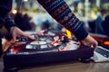 Turntable, hand of dj on the vinyl record at night club. blured background Royalty Free Stock Photo