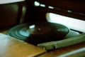 Turntable, Old record player stylus on a rotating disc, vintage filtered, selective focus Royalty Free Stock Photo