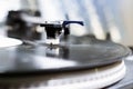 Turntable playing vinyl close up with needle on the record. close - up selective focus