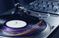 Turntable playing vinyl with glowing abstract lines Royalty Free Stock Photo