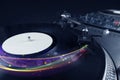 Turntable playing vinyl with glowing abstract lines Royalty Free Stock Photo