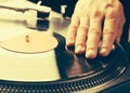 Turntable scratch, hand of dj on the vinyl record Royalty Free Stock Photo