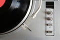 Turntable in silver case with vinyl record with red label top view Royalty Free Stock Photo