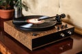 turntable with spinning vinyl record, stylus and dust cover Royalty Free Stock Photo