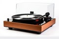 turntable with spinning vinyl record, stylus and dust cover Royalty Free Stock Photo