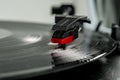 Old record player stylus on a rotating disc, vintage. Royalty Free Stock Photo