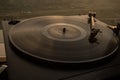 Turntable vinyl record player on the background of a sunset over the mountains. Sound technology for DJ to mix & play music. Black Royalty Free Stock Photo